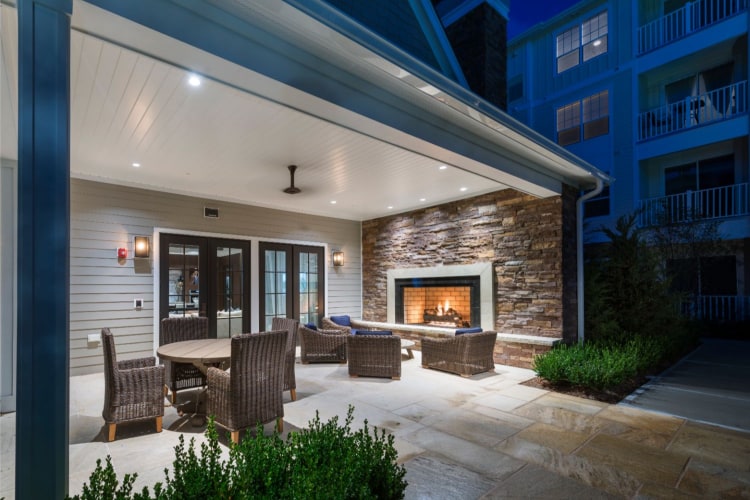 Outdoor lounge and fireplace at The Point at Merrimack River