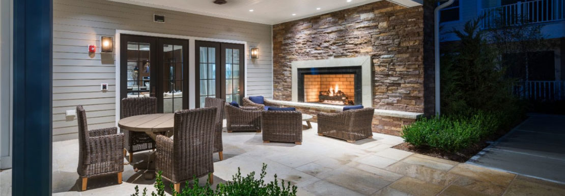 Outdoor fireplace and lounge at The Point at Merrimack Valley