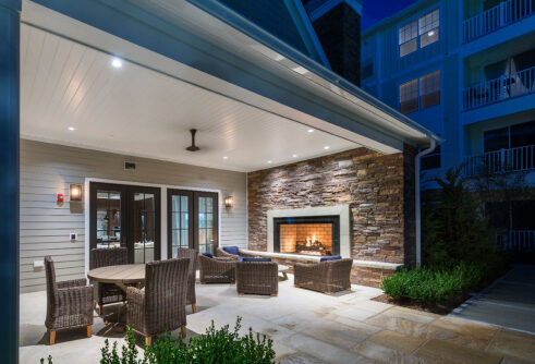 Outdoor lounge and fireplace at The Point at Merrimack River
