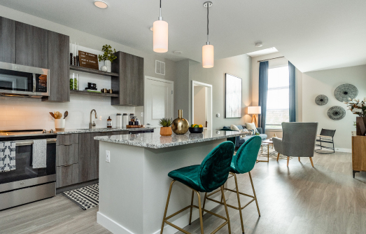 Kitchen and living room in apartment at The Point at Wrentham