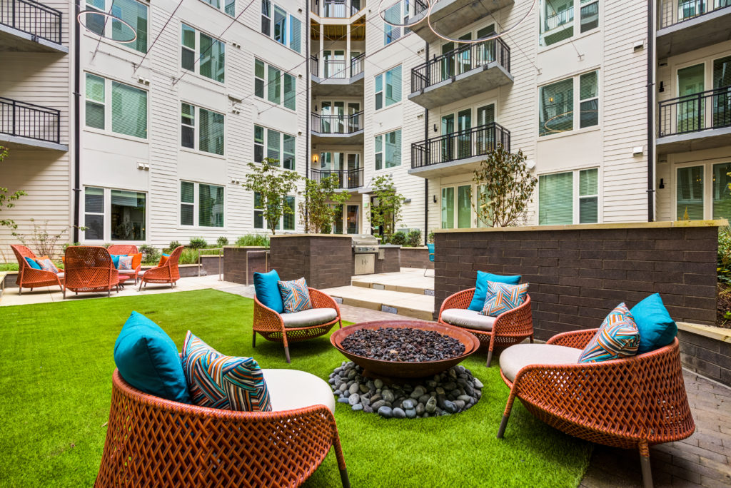 Outdoor courtyard with fire pit and seating at The Point at Reston