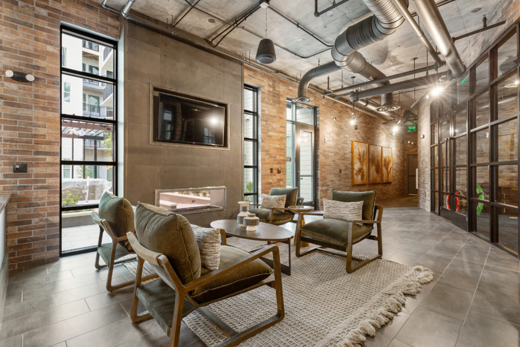 Community clubroom with fireplace at The Point at Reston