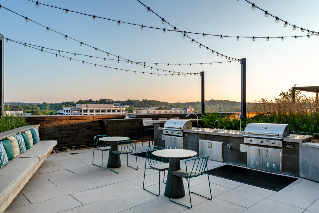 Outdoor deck at The Point at Eisenhower Square featuring grills and seating areas