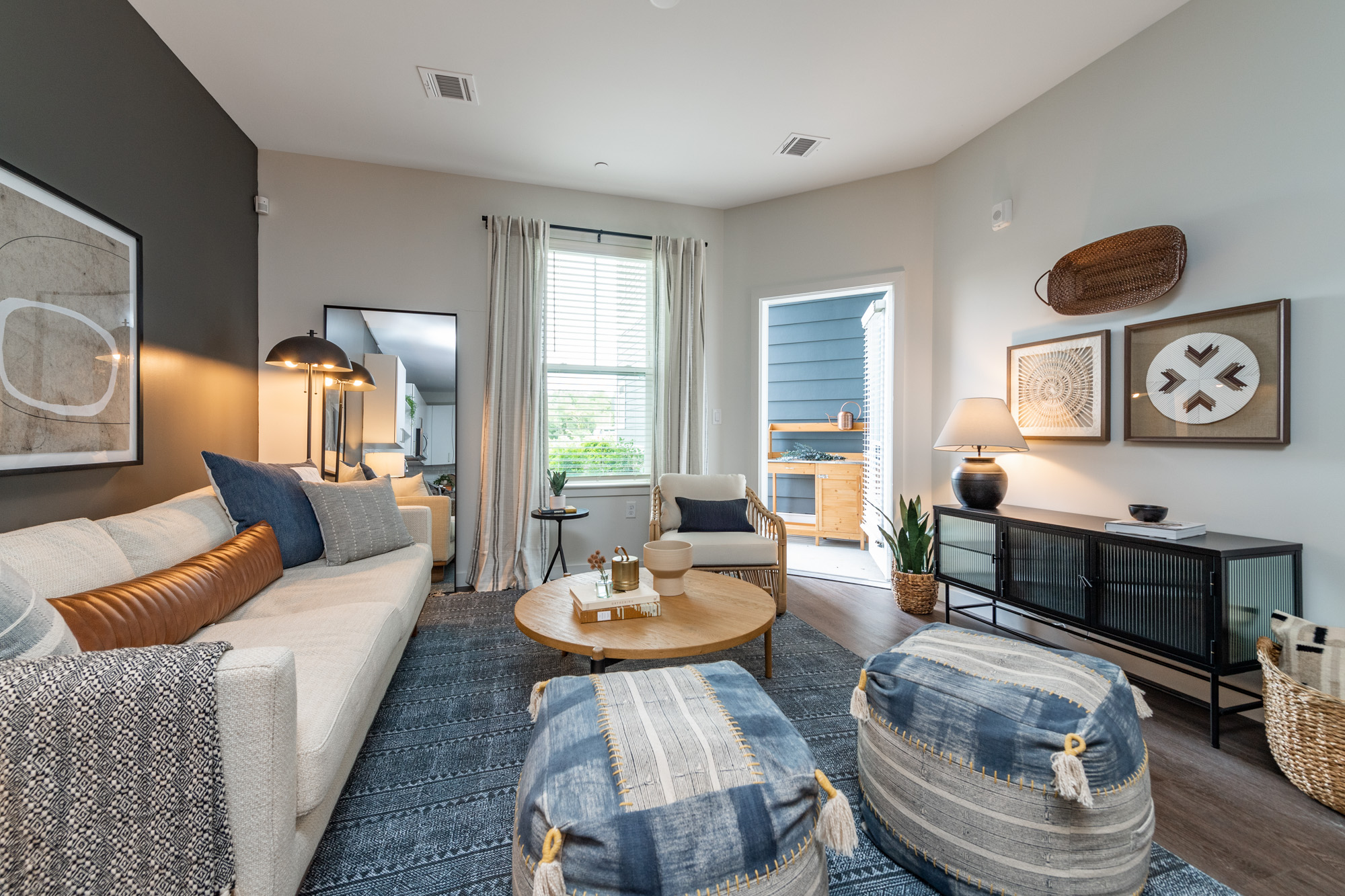 Apartment living room with outdoor balcony access at The Point at Kingston