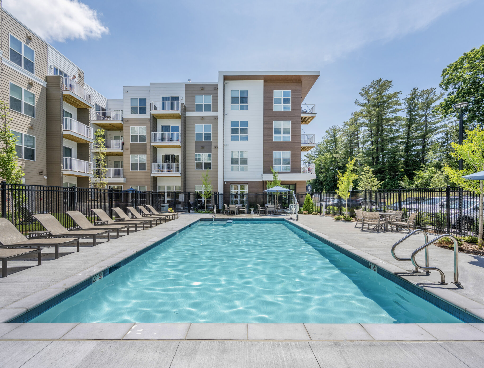 Outdoor pool and lounge seating at The Point at Merrimack Valley